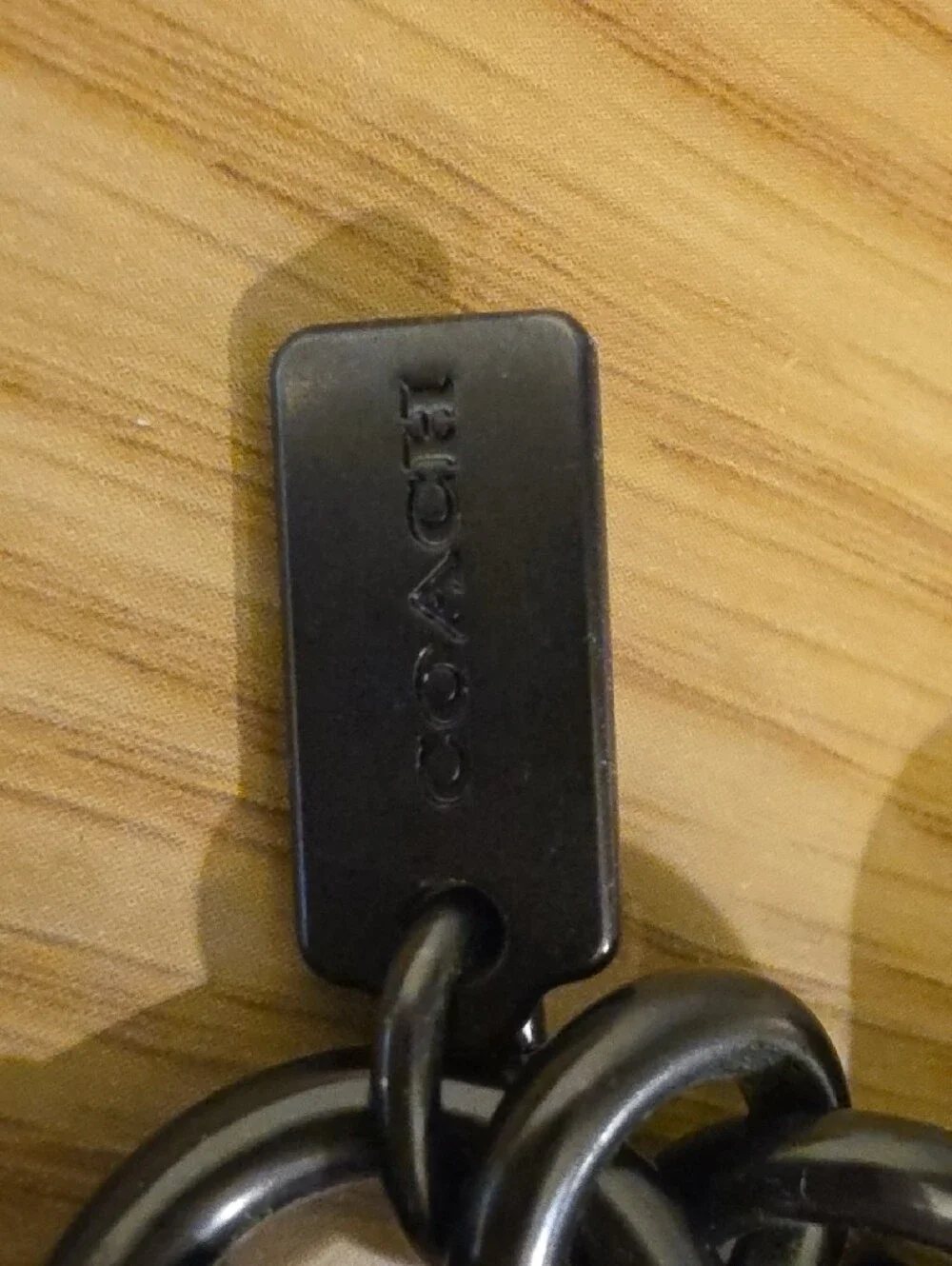 Coach Black Logo Keychain with Blue-Pink Gradient Lettering